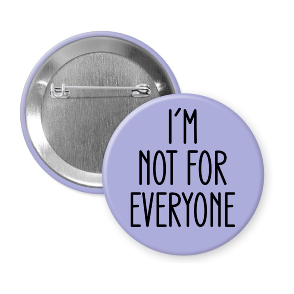 Purple pinback button with the text 'I'm not for everyone' printed in black.