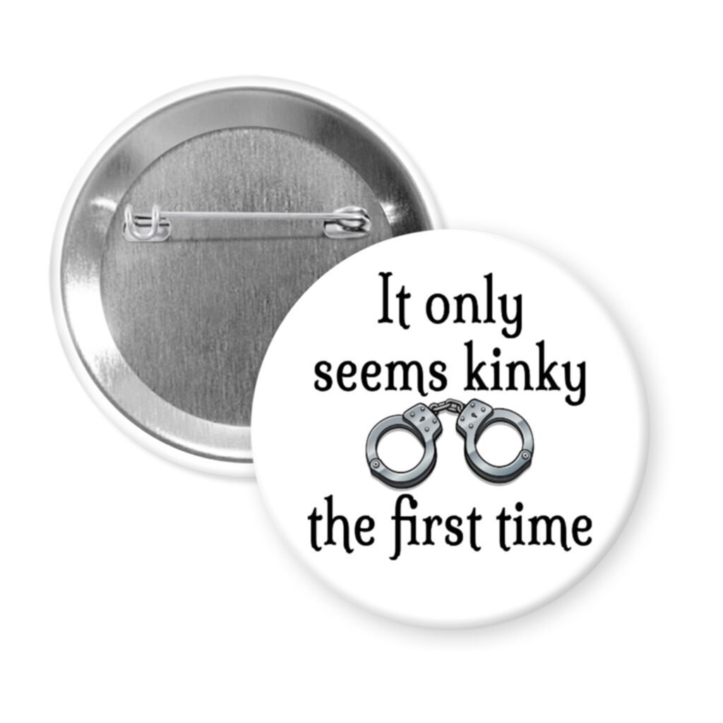 White pinback button with the text 'It only seems kinky the first time' and an image of handcuffs.