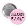 Pink pinback button with the text 'Religion is a cult' printed in black.