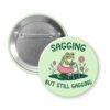 Button badge with a frog character and text 'Sagging but still gagging' on a light green background.