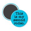 Blue magnet with the text 'This is my second rodeo.' printed in black.