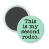 Mint green magnet with the text 'This is my second rodeo.' printed in black.