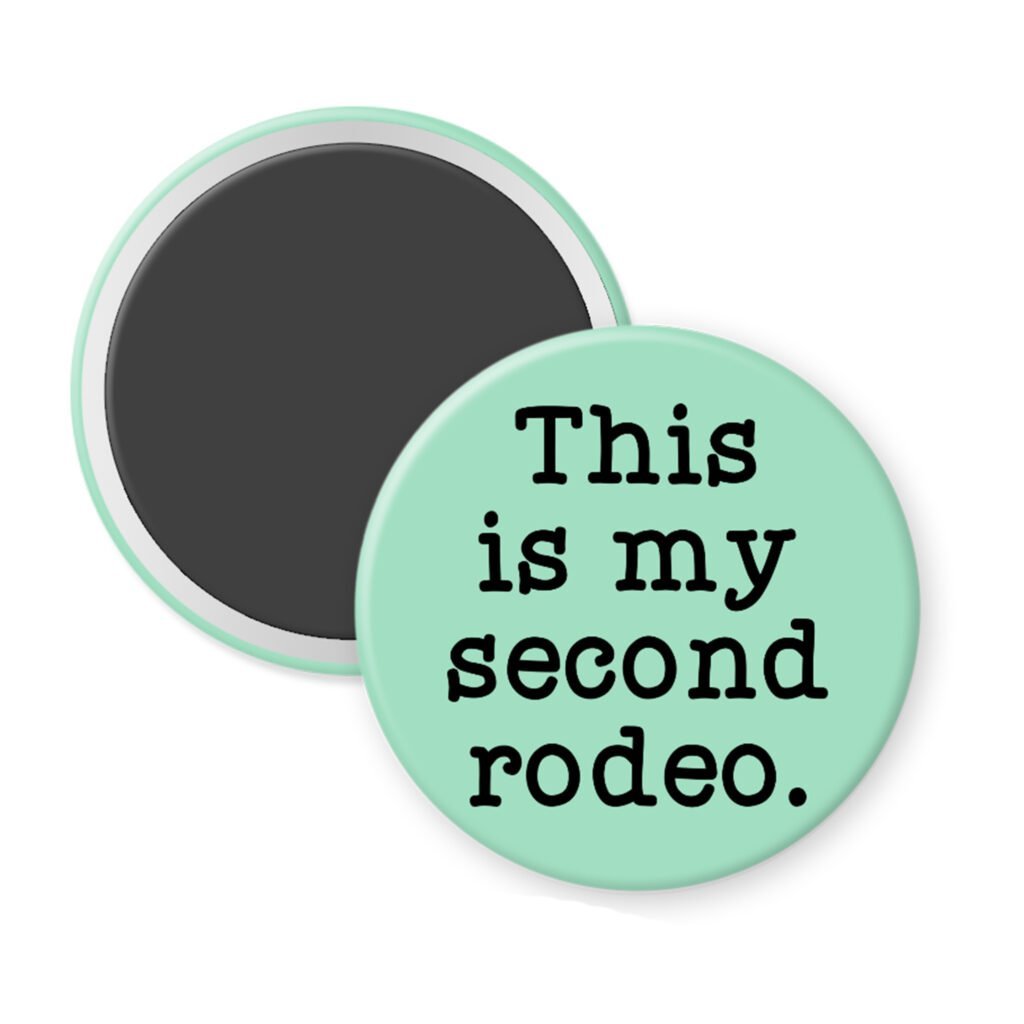 Mint green magnet with the text 'This is my second rodeo.' printed in black.