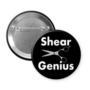 Black button with image of hair cutting shears and the words "Shear Genius".