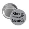 Grey pinback button with an image of haircutting shears and the text 'Shear Genius' printed in black.
