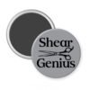 Grey magnet with an image of haircutting shears and the text 'Shear Genius' printed in black.