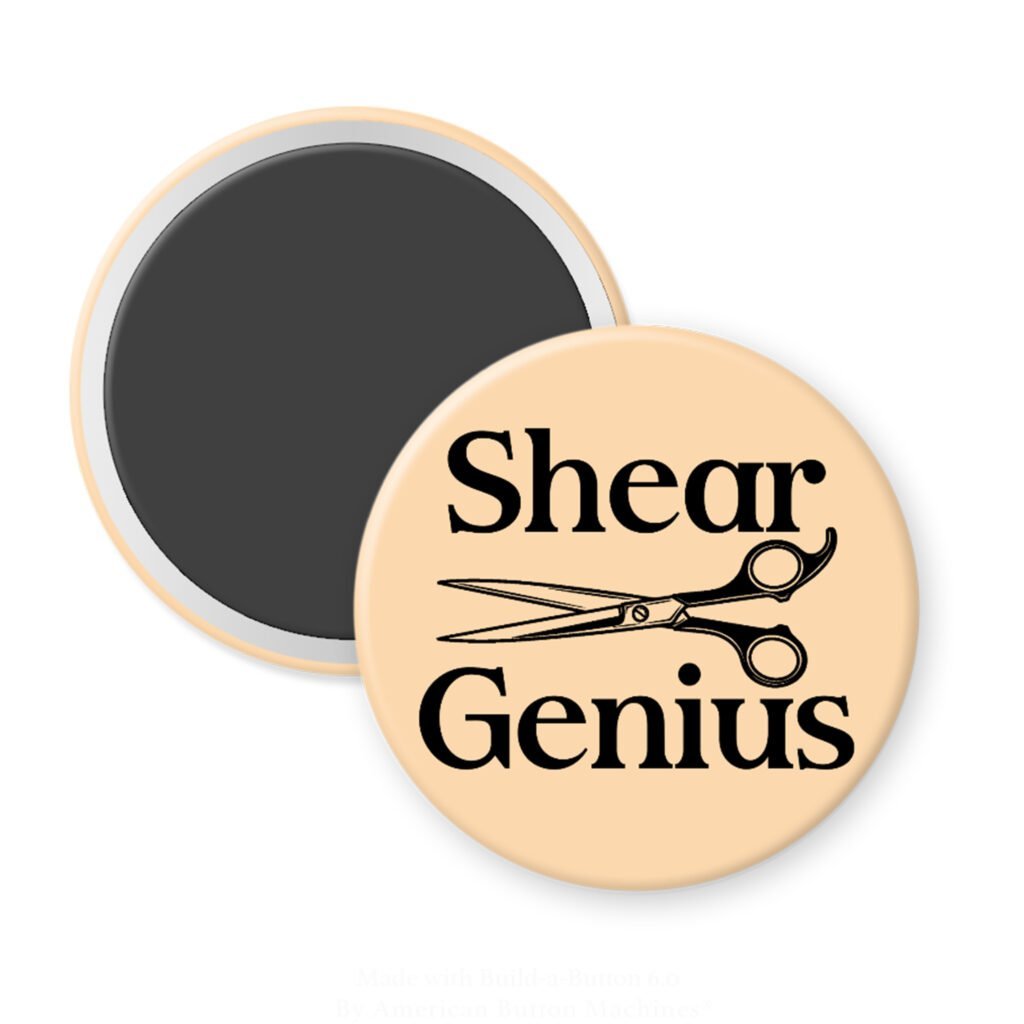 Peach color magnet with an image of haircutting shears and the text 'Shear Genius' printed in black.