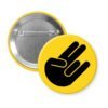 Yellow pinback button with the shocker hand gesture printed in black.