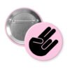 Pink pinback button with the shocker hand gesture printed in black.