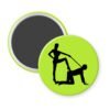 Green magnet with silhouette image of a man on his hands and knees and a dominatrix holding his leash.