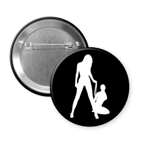 Button badge with a black silhouette design on a white background