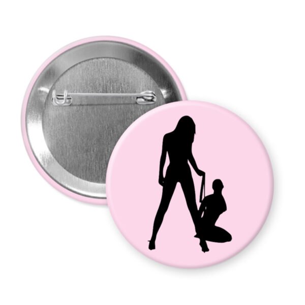 Button badge with a pink background and black silhouette design on a white background