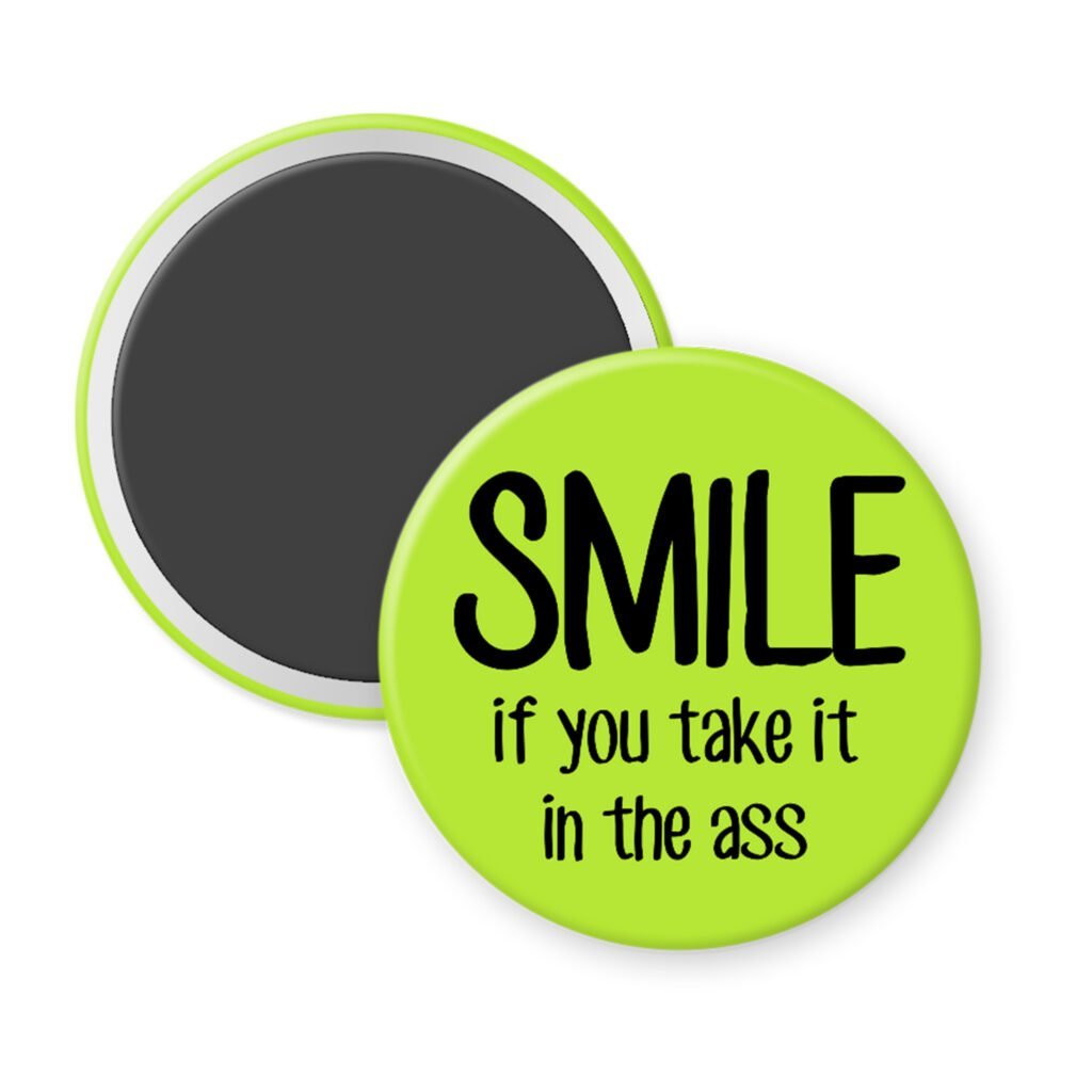 Green magnet with the text 'SMILE if you take it in the ass' printed in black.