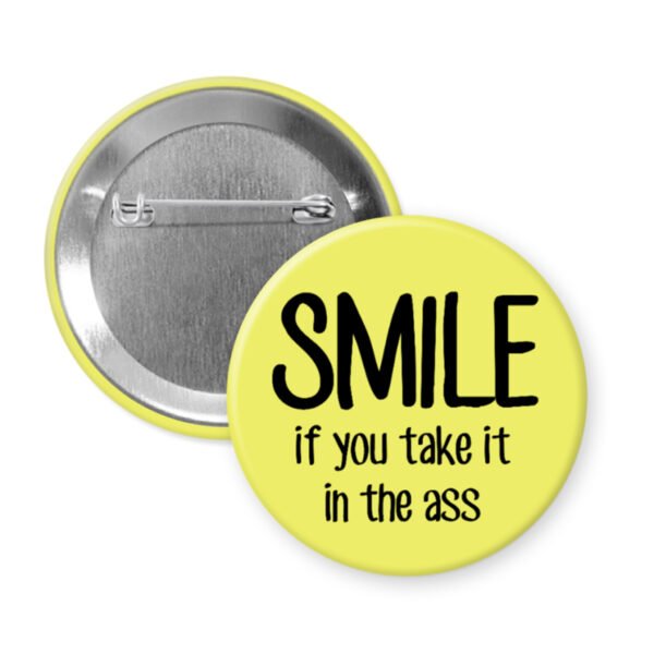 Yellow button that says "SMILE if you take it in the ass".