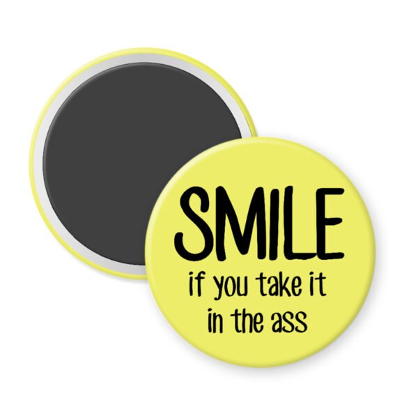 Yellow magnet that says "SMILE if you take it in the ass".