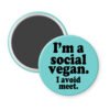 Blue magnet with the text 'I'm a social vegan. I avoid meet.' printed in black.