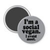 Grey magnet with the text 'I'm a social vegan. I avoid meet.' printed in black.
