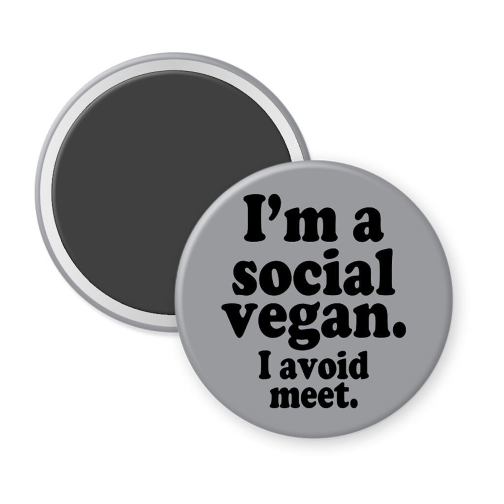 Grey magnet with the text 'I'm a social vegan. I avoid meet.' printed in black.