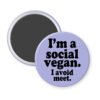 Purple magnet with the text 'I'm a social vegan. I avoid meet.' printed in black.