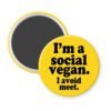 Yellow magnet with the text 'I'm a social vegan. I avoid meet.' printed in black.