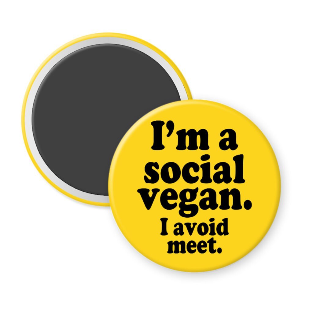 Yellow magnet with the text 'I'm a social vegan. I avoid meet.' printed in black.