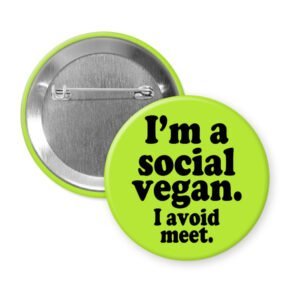 Green pinback button with the text 'I'm a social vegan. I avoid meet.' printed in black.
