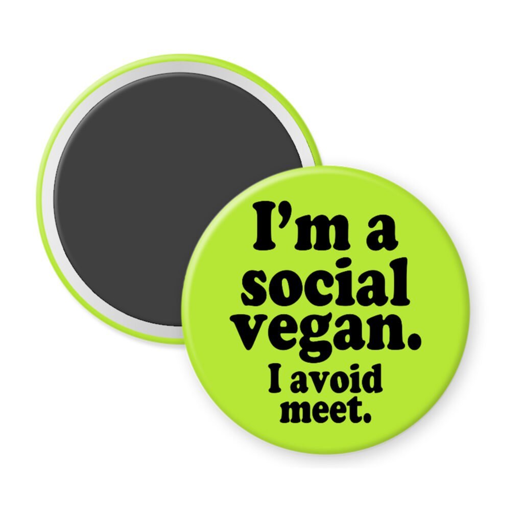 Green magnet with the text 'I'm a social vegan. I avoid meet.' printed in black.