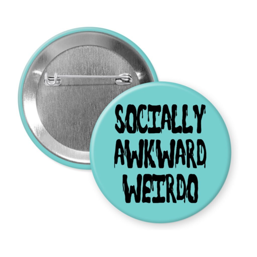 Blue pinback button with the text 'Socially awkward weirdo' printed in black drippy font.