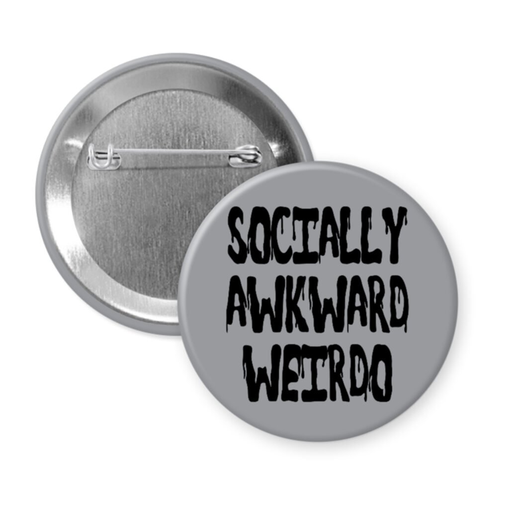 Grey pinback button with the text 'Socially awkward weirdo' printed in black drippy font.