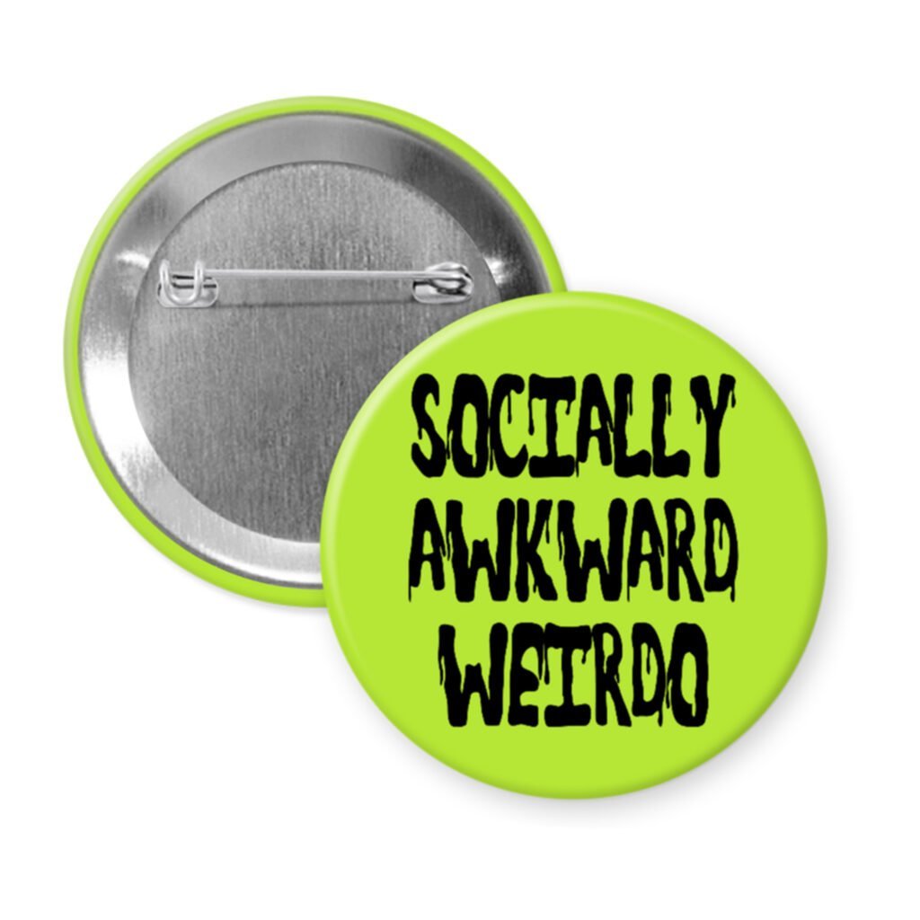 Green pinback button with the text 'Socially awkward weirdo' printed in black drippy font.