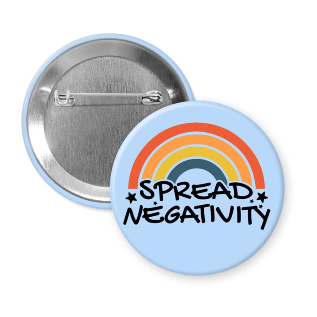 Funny parody button with rainbow and text 'Spread Negativity' on a light blue background