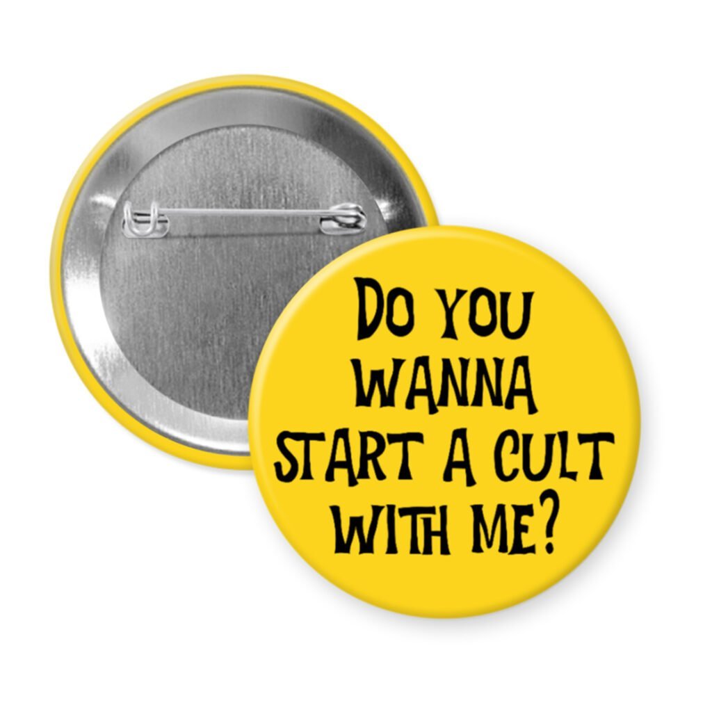 Yellow pinback button pinback button with the text 'Do you wanna start a cult with me?' printed in black.