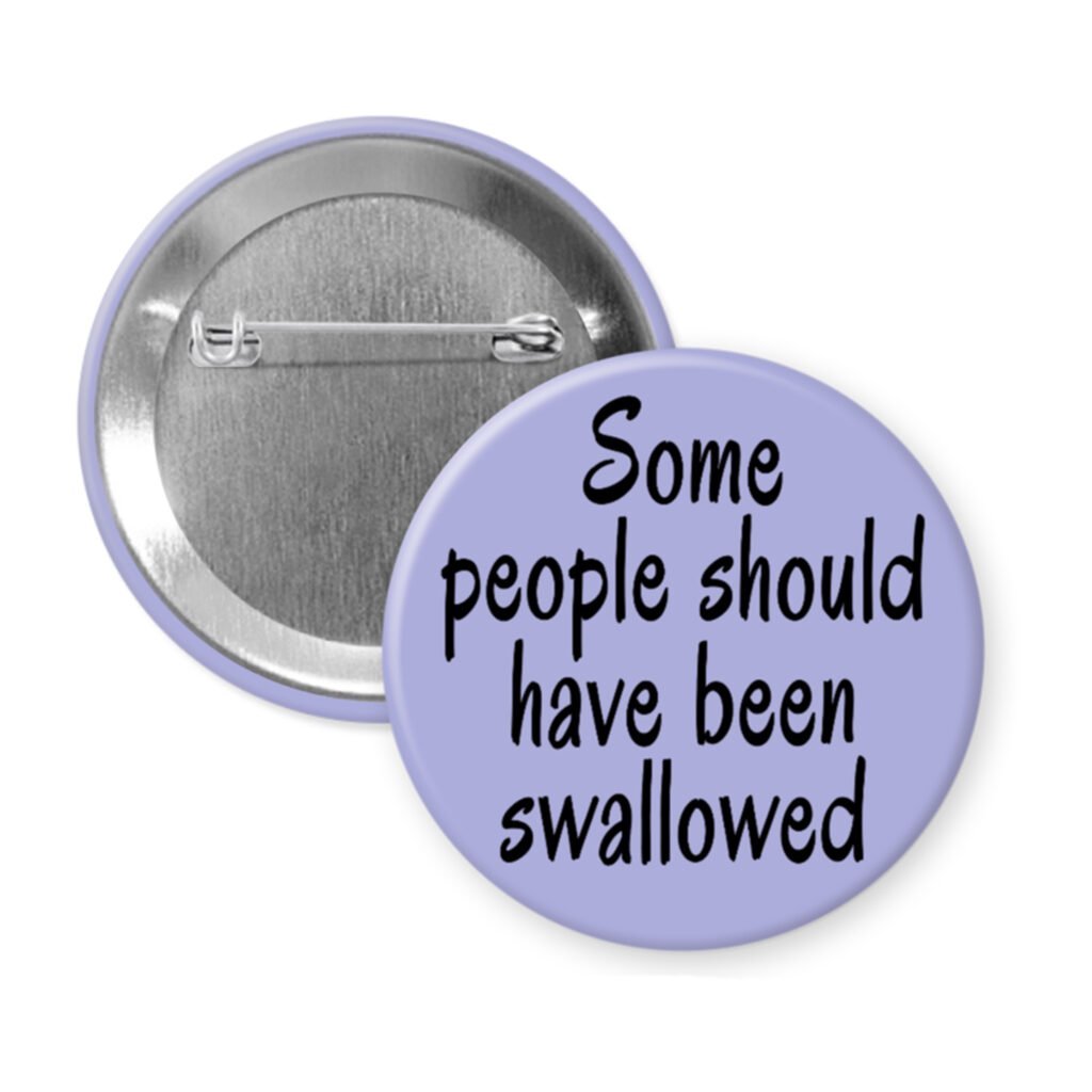 Purple pinback button with the text 'Some people should have been swallowed' printed in black.