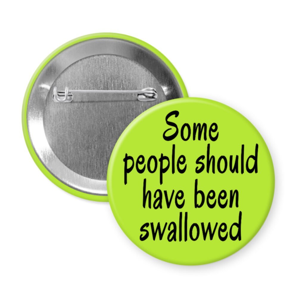 Green pinback button with the text 'Some people should have been swallowed' printed in black.