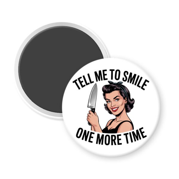 White magnet with image of a woman holding a knife and the phrase "Tell me to smile one more time"