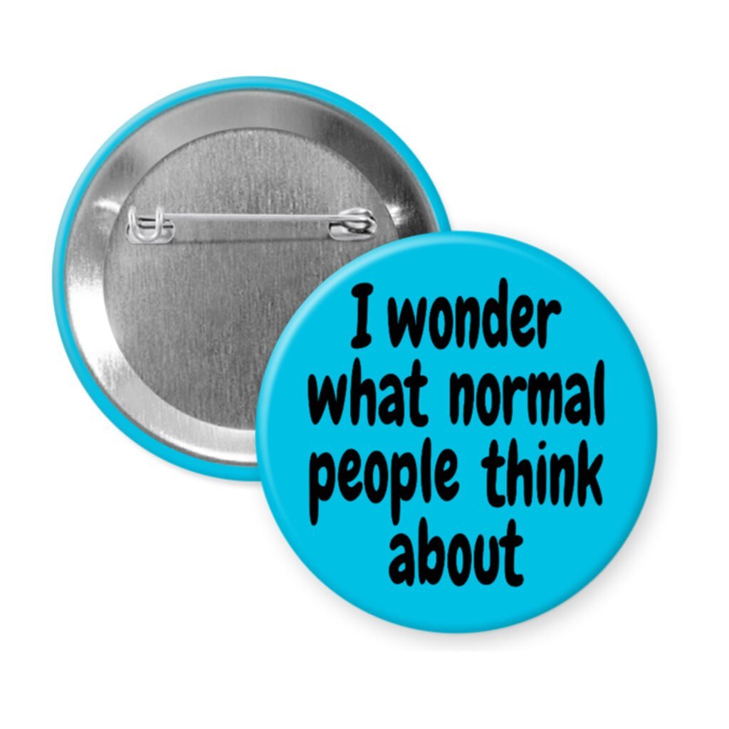 Blue pinback button with the text 'I wonder what normal people think about' printed in black.
