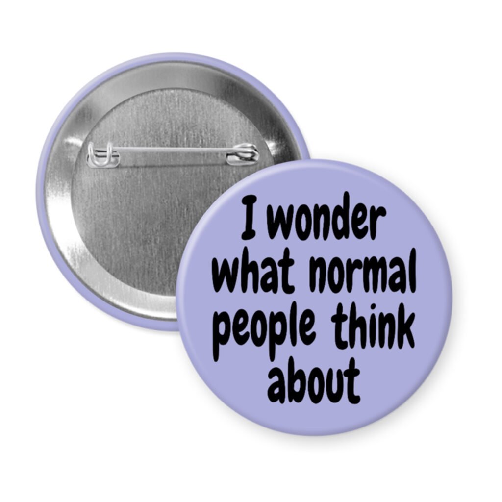 Purple pinback button with the text 'I wonder what normal people think about' printed in black.