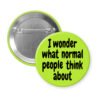 Green pinback button with the text 'I wonder what normal people think about' printed in black.