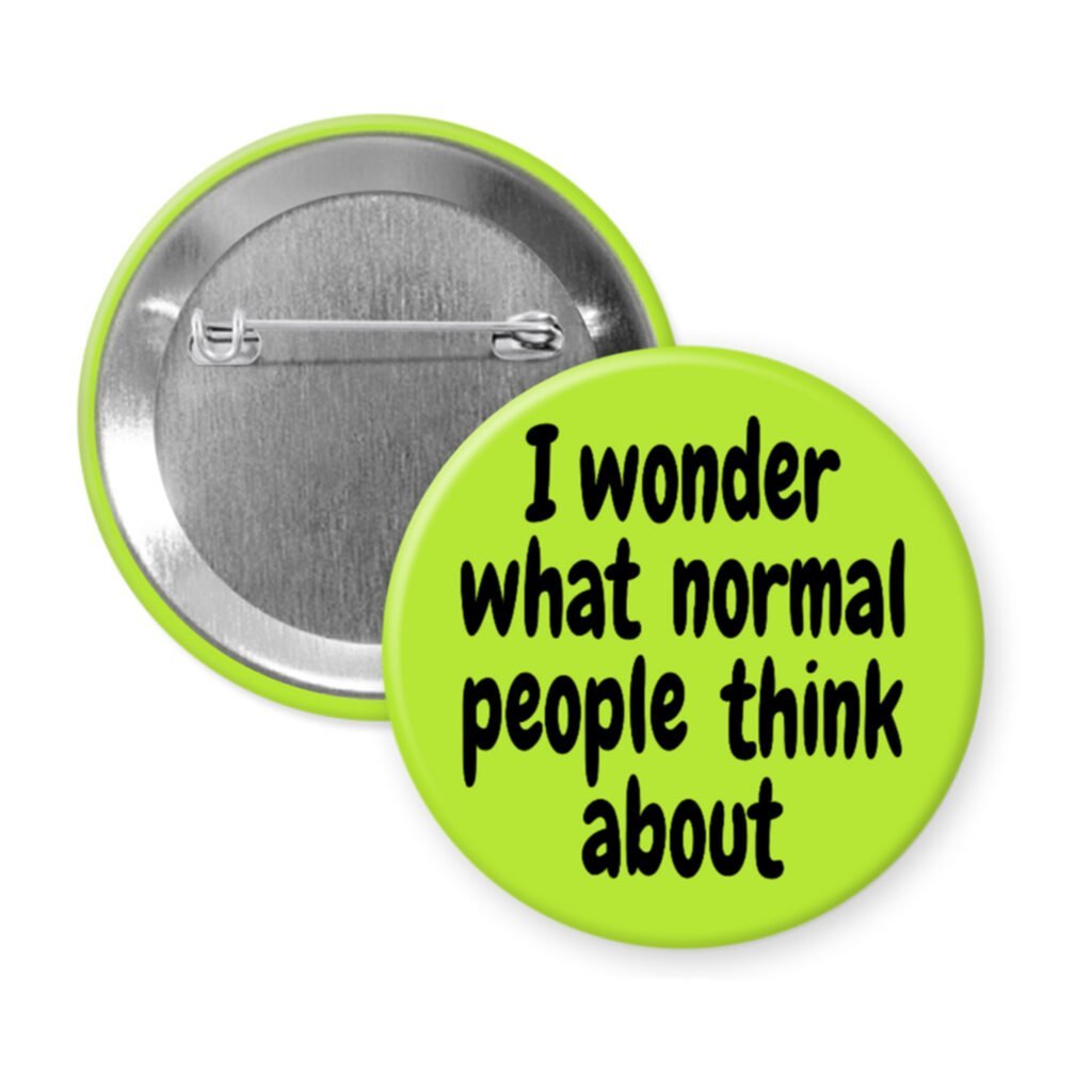 Green pinback button with the text 'I wonder what normal people think about' printed in black.