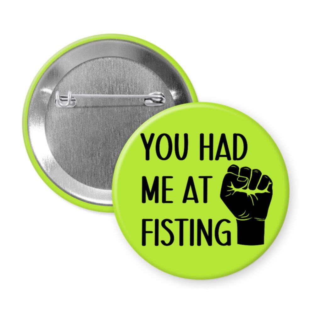 Green pinback button with an image of a fist and the text 'You had me at fisting'.
