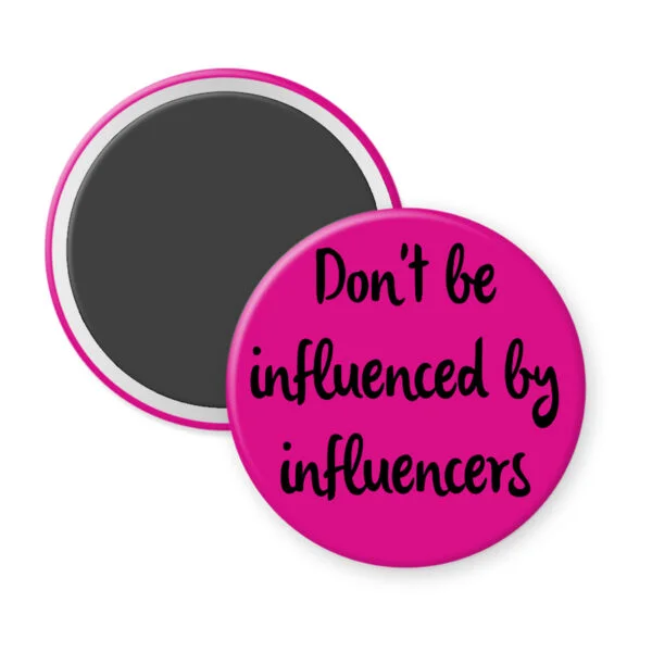 Pink magnet with the text 'Don't be influenced by influencers' in black text.