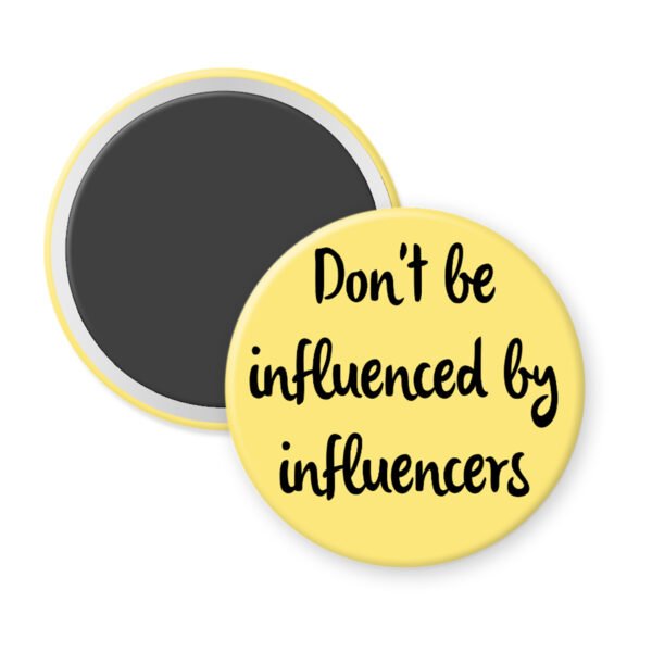 Yellow magnet with the text 'Don't be influenced by influencers' in black text.