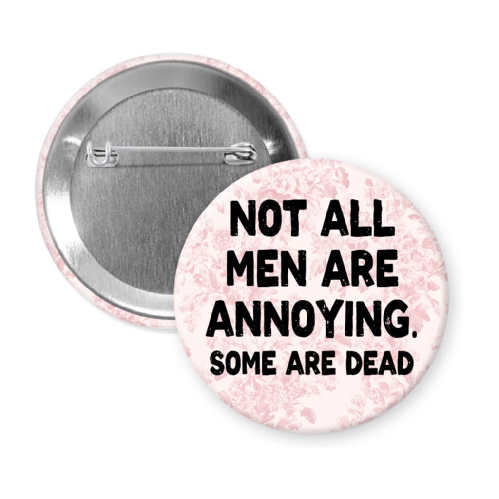 Pink floral print pinback button with the text 'Not all men are annoying. Some are dead' printed in black.