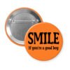 Orange button with the text 'SMILE if you're a good boy' printed in black.