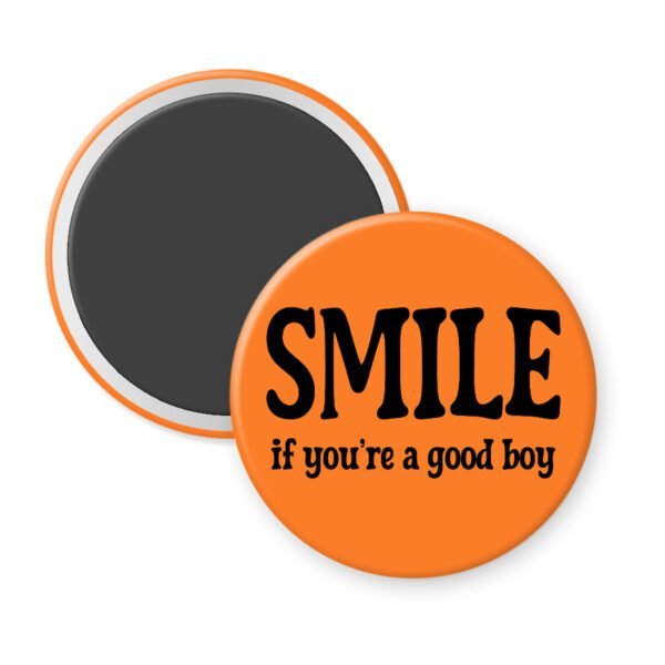 Orange magnet with the text 'SMILE if you're a good boy' printed in black.