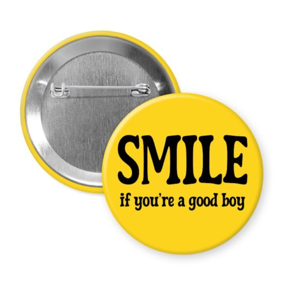 Yellow button with the text 'SMILE if you're a good boy' printed in black.