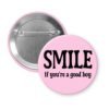 Pink button with the text 'SMILE if you're a good boy' printed in black.