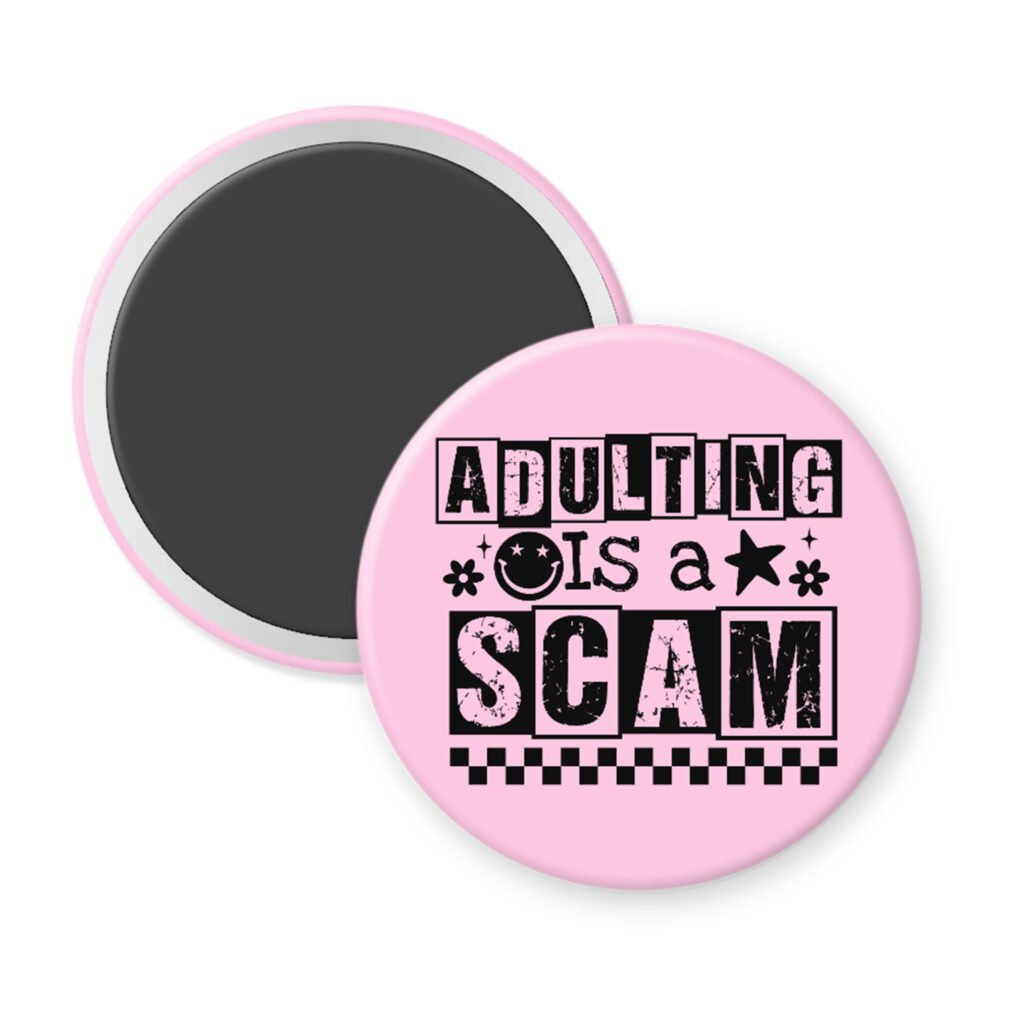 Pink magnet with bold black text reading ‘Adulting is a Scam’ in mixed block and distressed fonts. The design includes a smiley face, star, and flower icons, with a checkerboard stripe along the bottom.