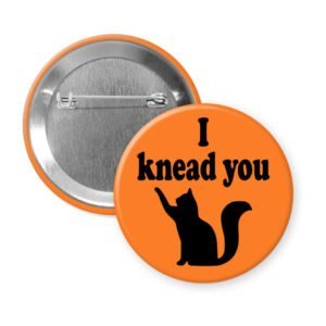 Orange pinback button with silhouette of a cat and the text 'I knead you.'