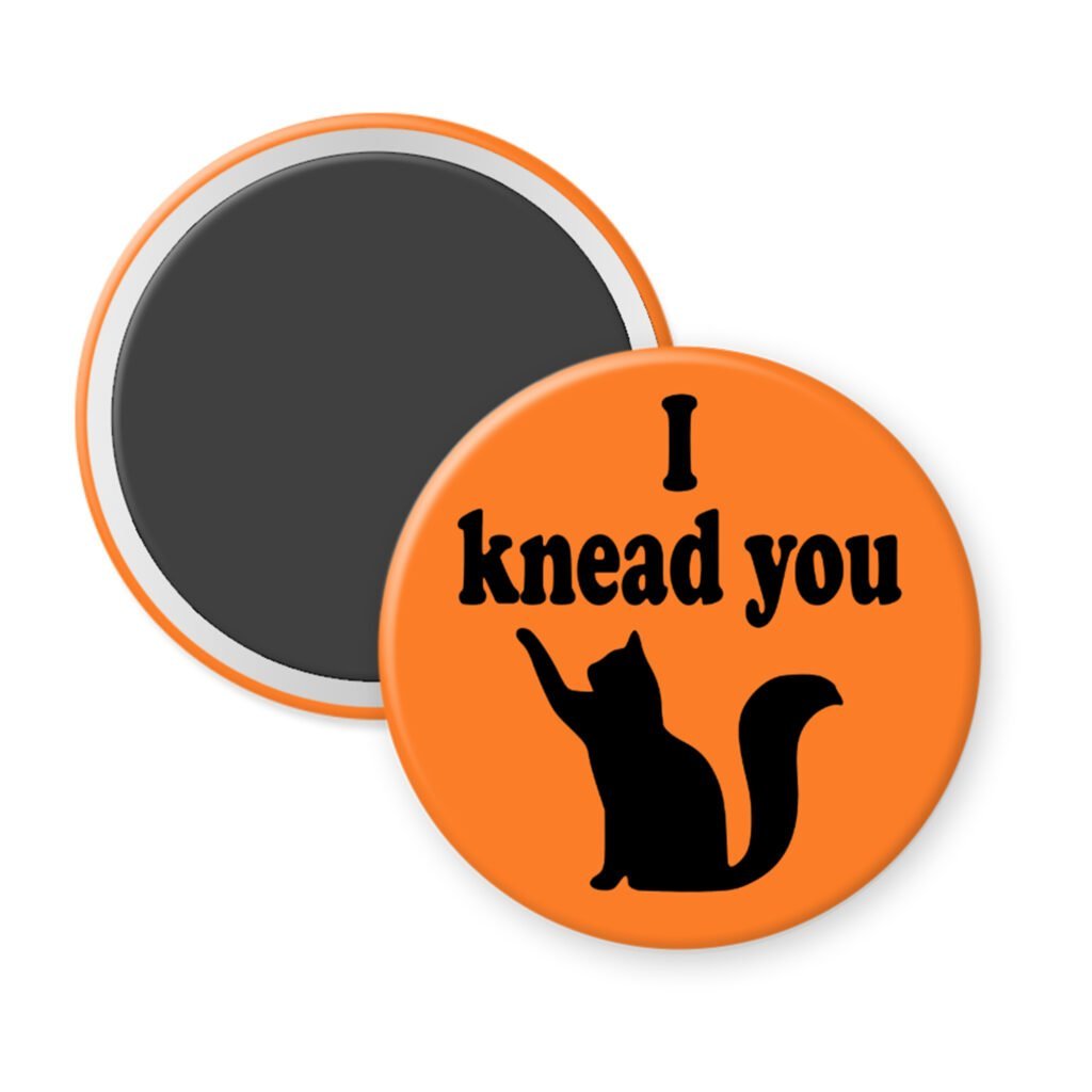 Orange magnet with silhouette of a cat and the text 'I knead you.'